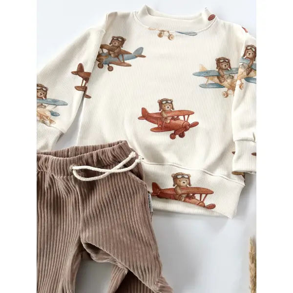 KOMPLET BLUZA PRĄŻKOWANA ODLOTOWE MISIE + JOGGERY SZTRUKSOWE Z KIESZONKAMI NOUGAT